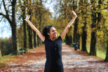 positive middle age woman stretching outdoors preparing for exercise in sportswear