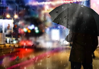 people silhouette with umbrella under rain in night cvity car traffic blurred light urban scene 