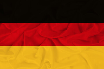 Obraz premium Stylish beautiful national flag of Germany on the background of wavy fabric, bright symbol-flag of Germany