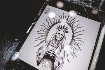 Tablet computer with plastic protection and design of a new tattoo of 'La Santa Muerte' (Our Lady of Holy Death)