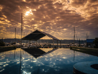 Dramatic cloudscape and water reflections over Sinclair Inlet near Bremerton Ferry Terminal in...