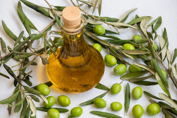 Image of raw olives and olive oil.	