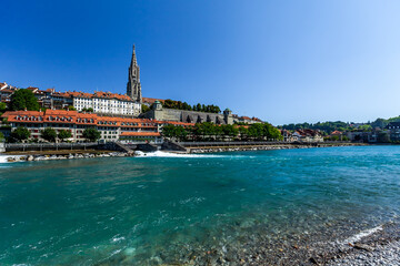 BERN, SWITZERLAND - August 8th 2022: Panoramic view of Bern and Berner Munster cathedral in a beautiful summer day, Switzerland