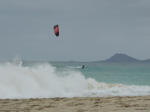 kitesurf, windsurf at sal island, cape verde, light blue sea, beautiful foam in the sea, white sand, fotocard of beach at sal island