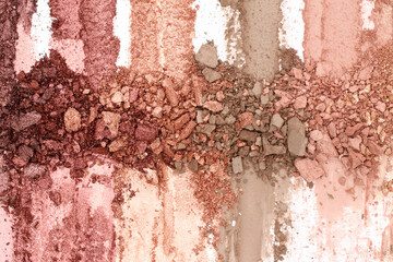 Broken and smashed make-up eyeshadow pallete, lay of brush strokes, for background, top view....