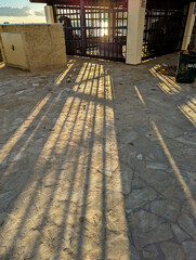 closed store shop by the ocean with steel bars reflections