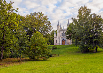 Fototapeta na wymiar Gothic Chapel in Peterhof is an Orthodox church in the name of Saint Alexander Nevsky situated in the Alexandria Park of Petergof, Russia.