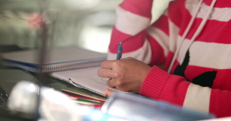 Concentrated woman working from home late at night on project