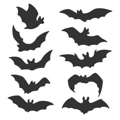 Silhouettes of flying bats. Horrific Halloween black bats. Flying foxes