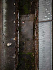 Old generic derelict industrial buildings in a dilapidated state aerial view