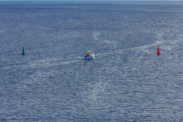 Red and green navigational buoys, starboard and port side buoys on open water