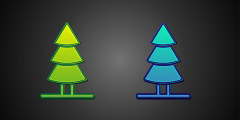 Obraz premium Green and blue Christmas tree icon isolated on black background. Merry Christmas and Happy New Year. Vector