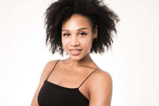 Portrait of a young woman curly hair, clean skin face model.