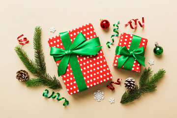 Top view Flat lay Christmas decorations and gift box on colored background with copy space. Christmas or Happy New Year composition