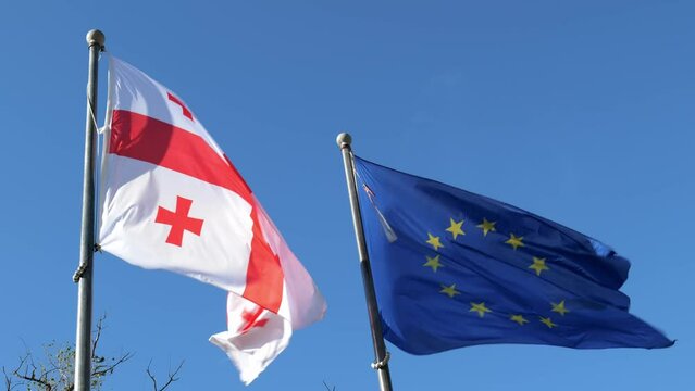 Georgia flag and EU flag. Flag of the country Georgia and European union together