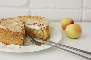 yummy homemade traditional apple pie with meringue hat close-up