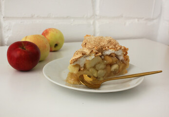 a piece of appetizing homemade apple pie on a plate closeup