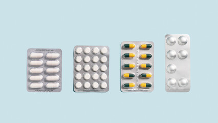 Banner with medicine pills and tablets on blue background.
