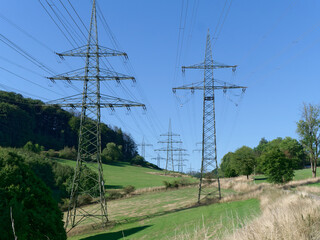 Various electricity pylons with high voltage transmission lines