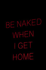 Isolated red neon sign that says be naked when i get home