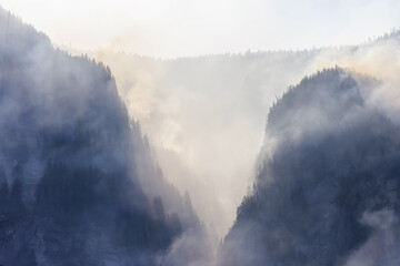 BC Forest Fire and Smoke over the mountain near Hope during a hot sunny summer day. British Columbia, Canada. Wildfire natural disaster