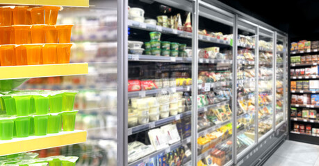 Choosing food from shelf in supermarket,vegetables in grocery section,Grocery stores