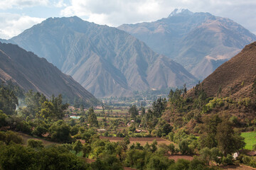 View of the Sacred Valley from the village of Urquillos, mountains and forest, in Peru. 