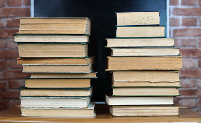 Books on a blackboard background