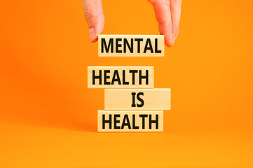 Mental health psychological symbol. Concept words Mental health is health on wooden blocks on a...