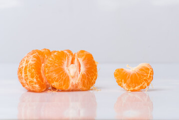 mandarin orange segments, sweet fruit in segments, color orange.