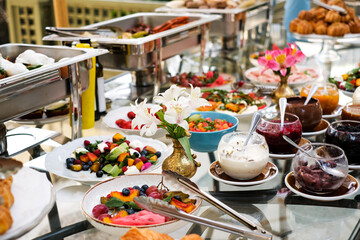 fruit salad on the buffet table with pastries