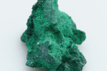 Obraz premium Natural gemstone green malachite on white background