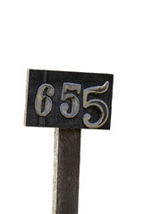 Aged wooden sign with house numbers.