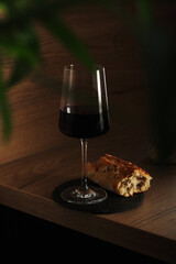 A glass of wine with bread in minimalistic style