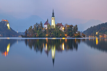 Fototapeta na wymiar Stunning sunset view of popular tourist destination Bled lake.