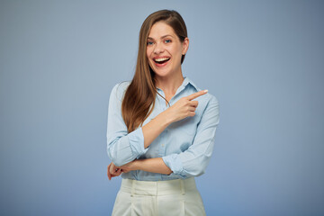 Smiling woman pointing finger. Isolated portrait female business person. - 530445240
