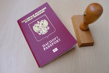 foreign, International biometric passports of citizen of Russian Federation with red cover on light...