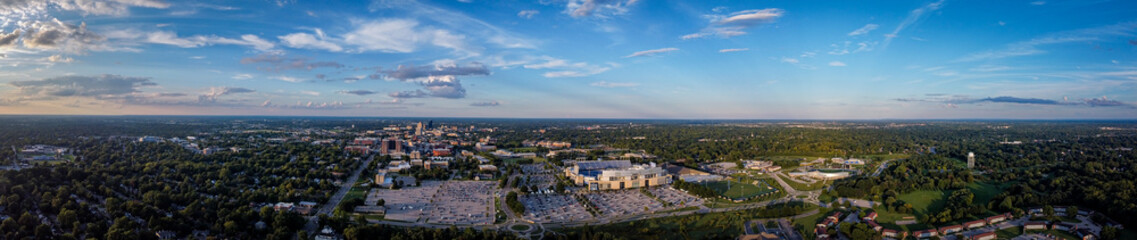 Aerial panorama of University of Kentucky campus with the football stadium parking lot on the foreground