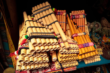 Set of pan flutes (siku) from South America on a stall in a local craft market in Peru, Cusco....
