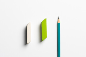 top view of the rubber eraser with pencil on pastel background