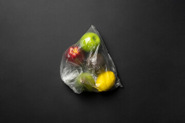 fresh fruit food in the plastic bag package. apple, orange, banana, avocado