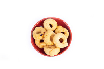 Tarallini or Taralli an Italian Snack Ring or Cracker Isolated on White in a Red Bowl in a Flat Lay or Top Down View Shot