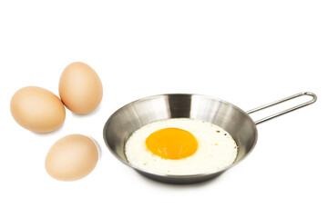 Scrambled eggs and whole raw eggs isolated on white background with clipping path.