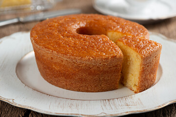 Homemade round cornmeal cake, typical Brazilian foodmade from corn in a June party and dish on a...
