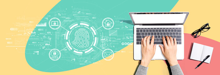 Fingerprint scanning theme with person using a laptop computer