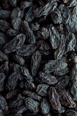 Close up black raisin background.