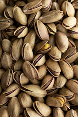 Background of pistachios in the shell.
