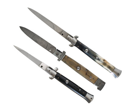 Three old switch blade knives isolated.
