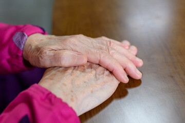 A wrinkled grandmother's hand