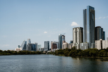 Austin city skyline view from the boardwalk with ladybird lake on a sunny day 